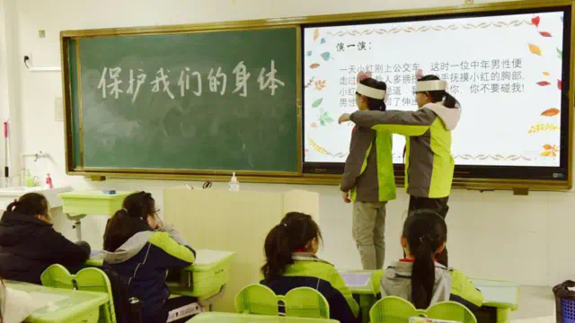A teacher teaches primary school students about identifying and preventing sexual assault in Hefei, Anhui Province, China, March 17, 2021